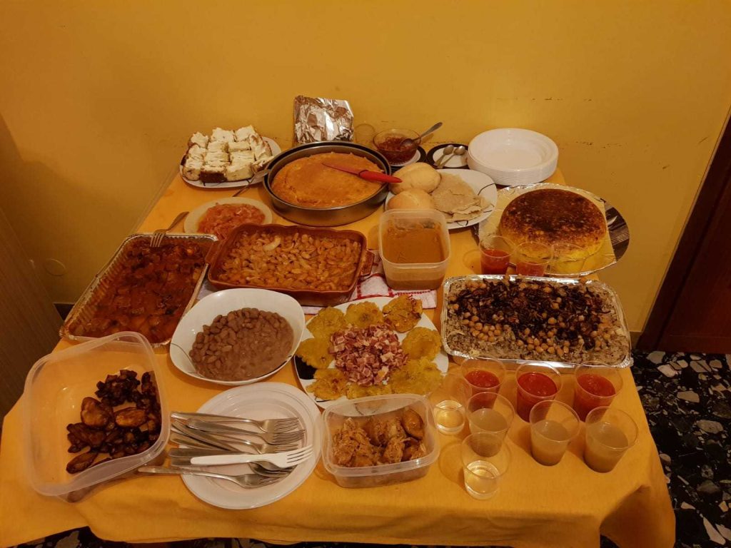 A laid table full of food from all around the world